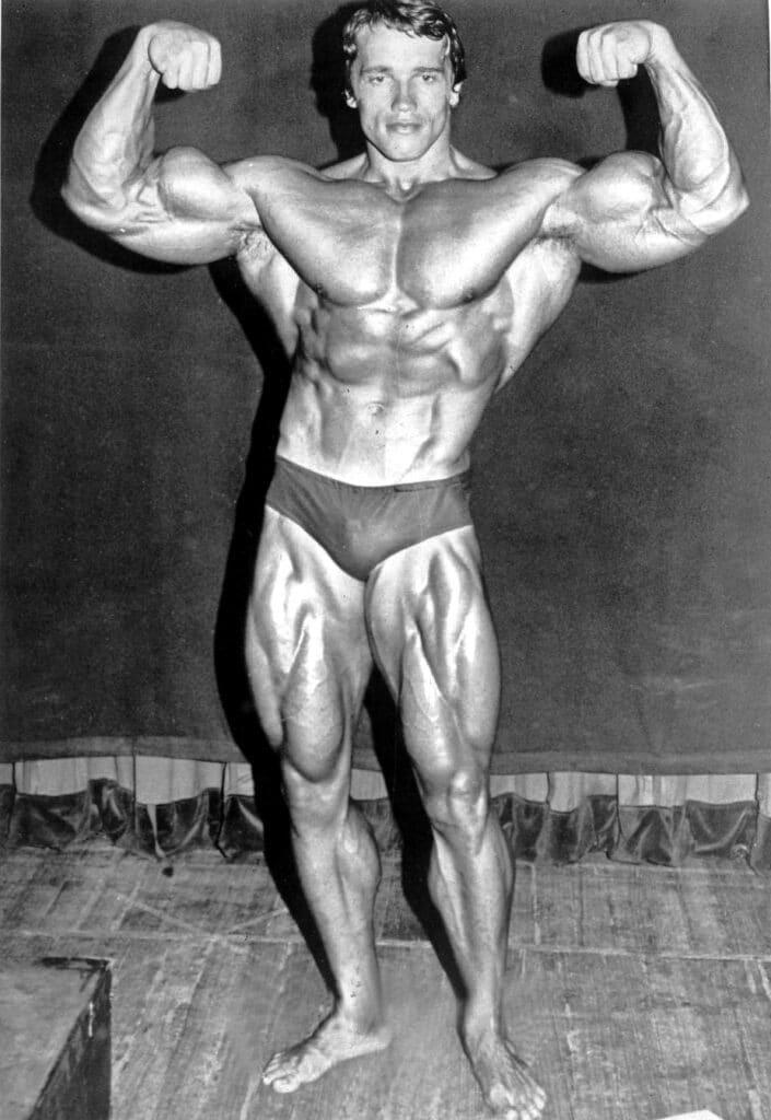 Arnold Schwarzenegger before defending the title for his fifth Mr. Olympia contest in 1974. Source: Wikimedia Commons.