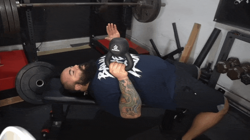 Professional strength trainer, Joseph Lucero, shows how to do bottoms-up chest presses with a kettlebell.