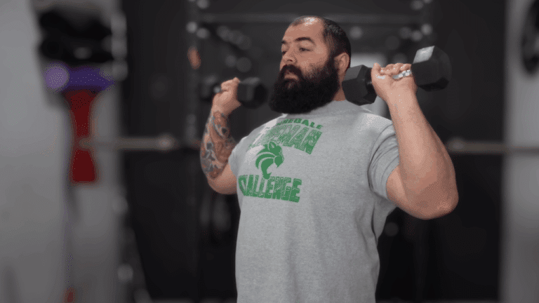 A strength coach explains how to measure your true dumbbell press strength and what counts as beginner, intermediate, or elite.