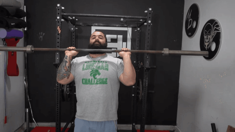 A video clip with a professional strength coach showing proper form for the military press.