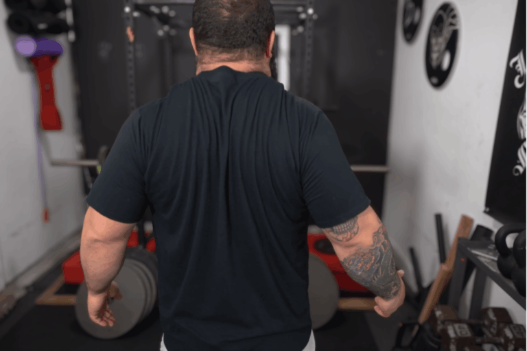 A strength coach shows this back movement for shoulder stability.