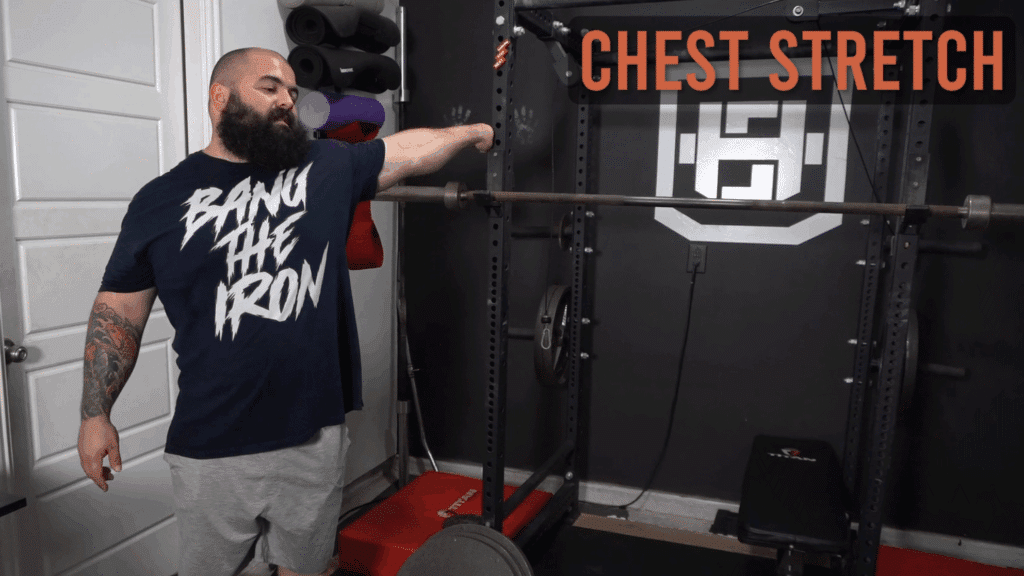 A strength coach shows how to do chest stretches with a rack.