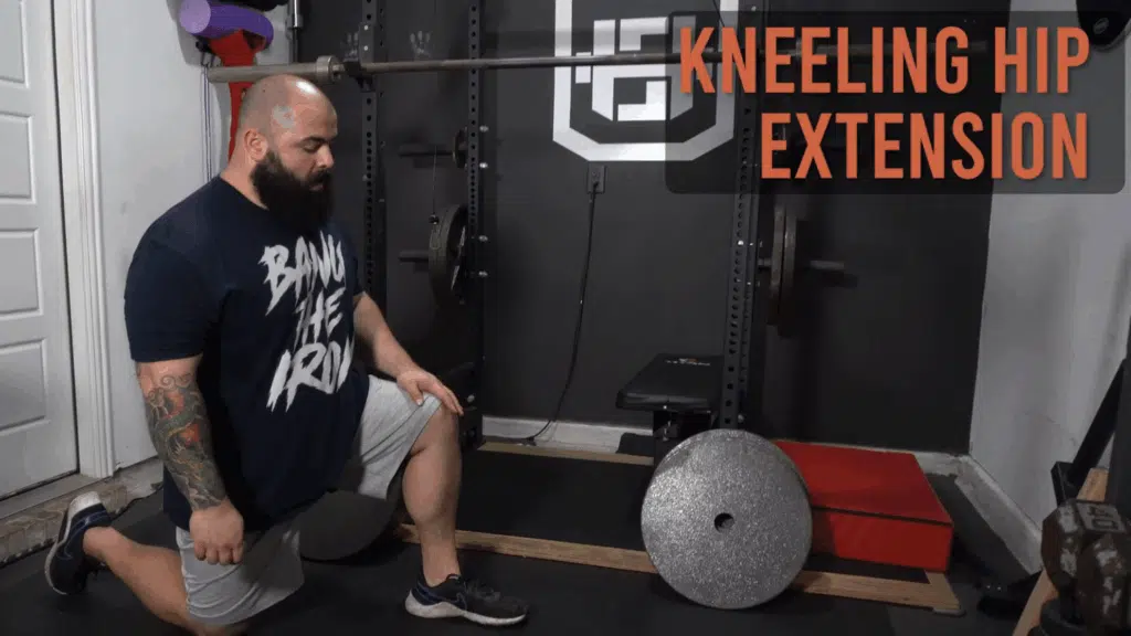 While explaining static vs dynamic stretching, strength coach shows how to do kneeling hip extensions.