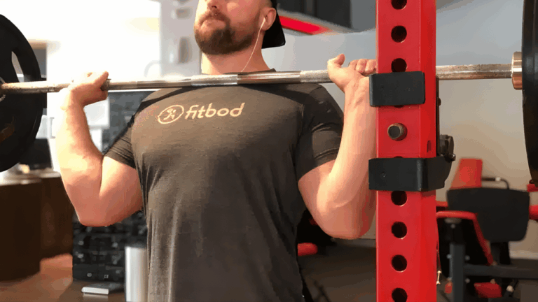 Powerlifting Coach Avi Silverberg shows the top position of the overhead press.