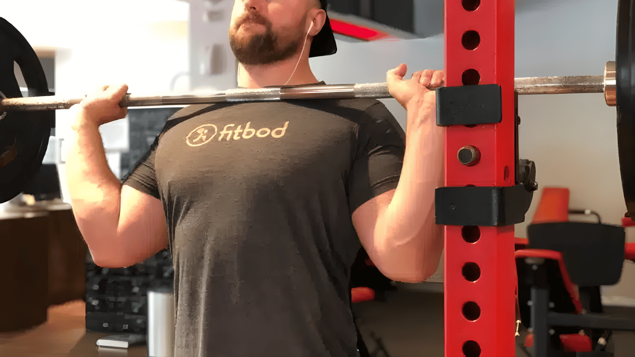 Powerlifting Coach Avi Silverberg shows the top position of the overhead press.