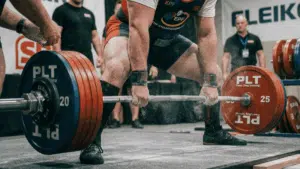 a powerlifter at the start of a heavy conventional deadlift