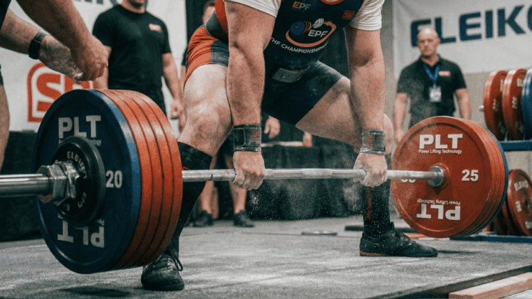 a powerlifter at the start of a heavy conventional deadlift