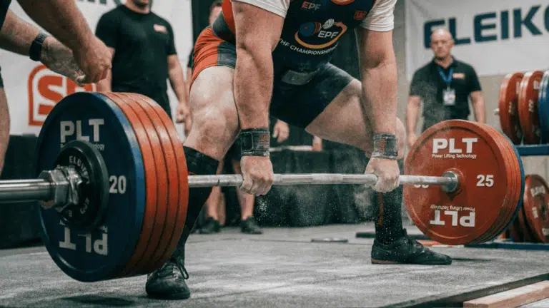 a powerlifter at the start of a heavy conventional deadlift